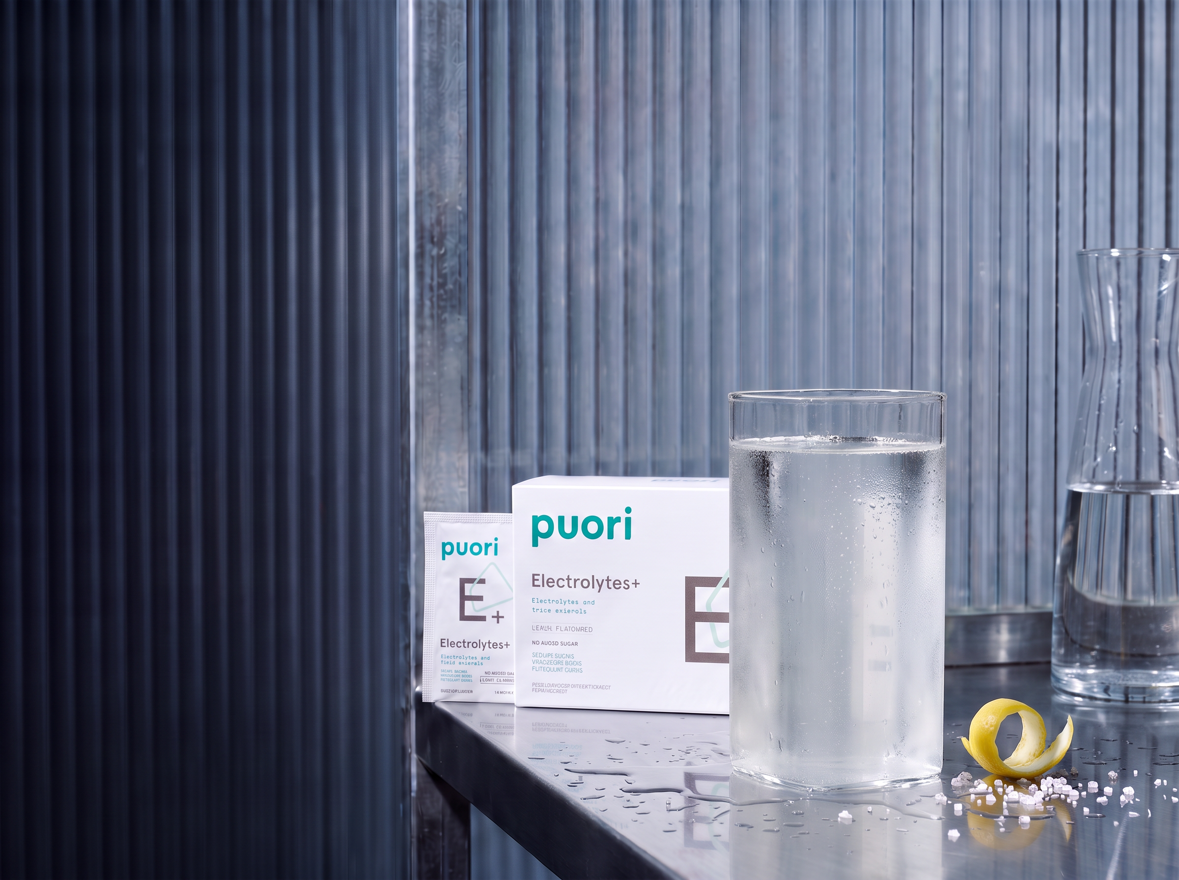 The finished Puori Electrolytes+ drink in a cold straight-sided glass with condensation